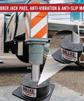 Heavy Duty Rubber RV Jack Flex Pads 12 Inch 4 Pack in use under a camper stabilizing jack preventing sinking and sliding.
