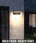 Black 2 Pack Solar Motion Sensor Outdoor Lights With 600 Lumen Brightness 3 Modes IP44 Waterproof on rainy wall