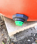 Three Quarter Inch Drain Valve Plug Kit With Silicone O Ring And Bulkhead Adapter, installed on a tank, forest green plug