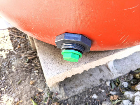 Three Quarter Inch Drain Valve Plug Kit With Silicone O Ring And Bulkhead Adapter, installed on a tank, forest green plug