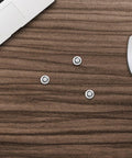10Pcs M3 Black Hard Drive Mounting Screws For Laptops And Electronics Self Tapping Fasteners on wooden desk with laptop and mouse.
