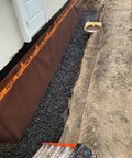 Kickass Rubberized Waterproofing Sealant For Foundations And Flat Low Slope Roofs Concrete Wood Metal Black Five Gallon Multi Purpose Coating applied to foundation with gravel.