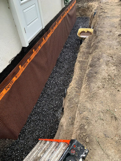 Kickass Rubberized Waterproofing Sealant For Foundations And Flat Low Slope Roofs Concrete Wood Metal Black Five Gallon Multi Purpose Coating applied to foundation with gravel.