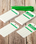 Top Shelf Safety Inspection Tags Paired With Adjustable Wire Ties For Quick Equipment Checks And Job Site Warning Labels Built Tough Gritty Solid And Ready To Roll Whenever You Need It showing white inspection tags and green ties.