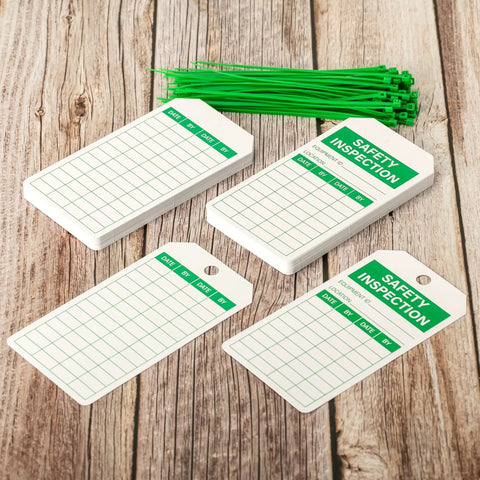 Top Shelf Safety Inspection Tags Paired With Adjustable Wire Ties For Quick Equipment Checks And Job Site Warning Labels Built Tough Gritty Solid And Ready To Roll Whenever You Need It showing white inspection tags and green ties.