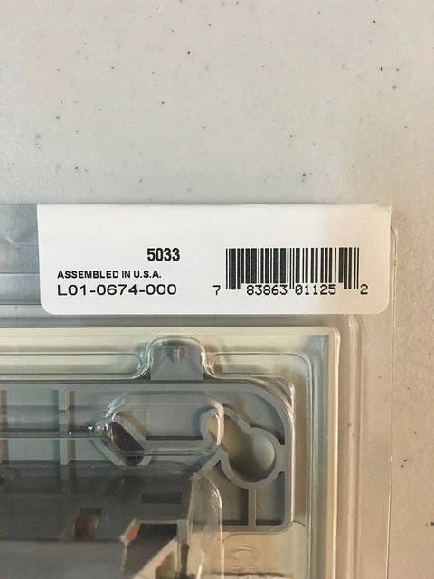 Packaging label of FRM-1 Control Relay Module For Fire Alarm Systems, showing barcode and assembly details.