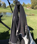 Magnetic Rangefinder Strap For Golf Carts And Rails Adjustable Mount Holder on a golf cart in a scenic golf course setting.