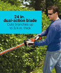 Man using 40V Max Cordless Hedge Trimmer with PowerDrive Transmission, 24-inch dual-action blade, trimming bushes outdoors.