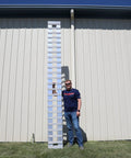 Heavy Duty Aluminum Loading Ramps For Trailers And Pickup Trucks 12 Feet Long By 15 Inches Wide 4000 Lbs Capacity single ramp standing next to a man.