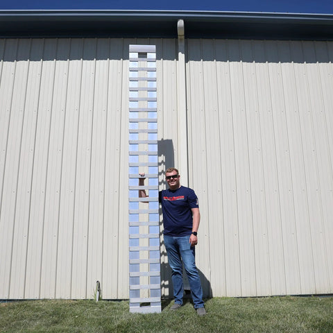 Heavy Duty Aluminum Loading Ramps For Trailers And Pickup Trucks 12 Feet Long By 15 Inches Wide 4000 Lbs Capacity single ramp standing next to a man.