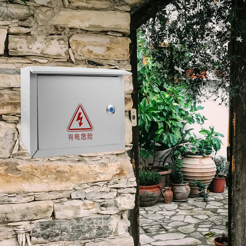 Weatherproof Outdoor Electrical Junction Box 300x400x160mm installed on stone wall, heavy duty iron enclosure for power control.