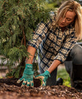 Woman gardening wearing Women's Hybrid Work And Garden Gloves With Water-Resistant HydraHyde Leather Medium Size