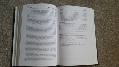 Open book showing pages on cosmetic science, part of Cosmetic Chemistry Essentials A Real World Practical Guide For The Beauty Industry Updated Edition With 21 New Chapters Covering Formulation Tips Ingredient Know How Safety And Market Trends.