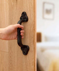 Beefy Heavy Duty Barn Door Handles Set Of 2 Black Rustic Cast Iron Gate Handles installed on a wooden sliding door
