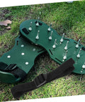 Eight Piece Lawn Aerator Shoes With Heavy Duty Straps And Spikes For Garden And Patio on grass, showing spikes and strap detail