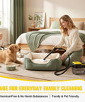 A woman using a handheld steam cleaner on a pet bed, showcasing Get Your Home Sparkling With This Powerful Handheld Steam Cleaner.