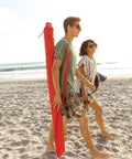 Couple on beach carrying Oversized 9 Foot UPF 50 Plus Umbrella Shelter With Privacy Panels For Sun And Rain Protection
