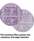 Close-up of Xtract Cubitron II Hookit Clean Sanding Film Disc 775L 220 Grit showing perforations and branding details.