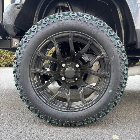 Rugged Four Seater Electric Golf Cart With Powerful Ac Motor Built To Crush Hills and Deliver Whisper Quiet Ride featuring black alloy wheel and all-terrain tire.