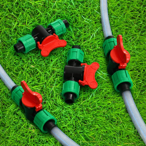 1/2 Inch Universal Drip Irrigation Shut Off Valve Set For Tubing Coupling Locking Fittings on green grass