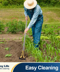 Person using adjustable 61 inch long handle stainless steel garden hoe for weeding grass roots and cutting soil.