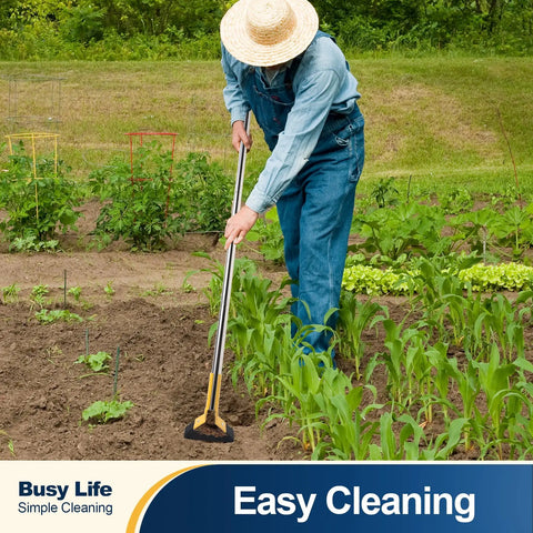 Person using adjustable 61 inch long handle stainless steel garden hoe for weeding grass roots and cutting soil.