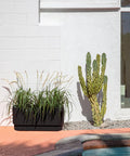 Long Planter For Porch Patio And Backyard In Durable Plastic Stone Composite Fluted All Weather Outdoor Pot For Shrubs And Flowers Modern Decor With Scratch And UV Resistant Finish near cactus and poolside