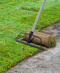 15 Inch Wide Bow Rake With 16 Steel Tines And Stainless Steel Handle For Loosening Soil Leveling Mulch Gathering Leaves And Lawn Care Built Tough Garden Tool on grass