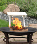 Round 23 Inch Wood Burning Fire Pit Insert For Outdoor Use Replacement Bowl on a patio with a view of logs burning.