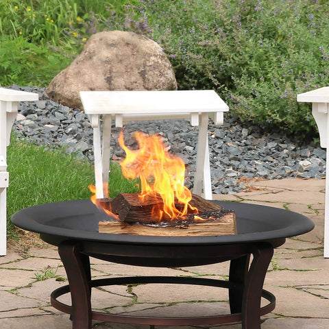 Round 23 Inch Wood Burning Fire Pit Insert For Outdoor Use Replacement Bowl on a patio with a view of logs burning.