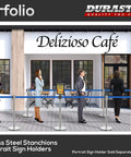 Heavy Duty Crowd Control Stanchions With 6.5 Foot Retractable Belts, Stainless Steel Posts In Silver With Blue Belts at Cafe Entry