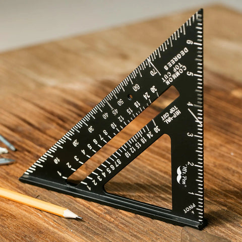 7 Inch Aluminum Rafter Square For Carpentry, Metal Triangle Square Ruler on wooden surface, pocket-sized with gradations.