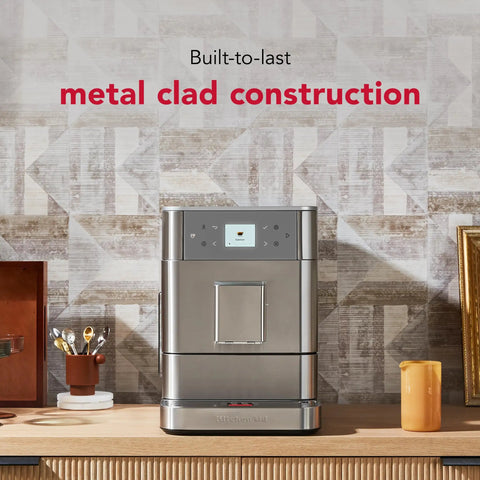 Premium Stainless Steel Fully Automatic Espresso Maker With 15 Signature Drink Recipes Removable Bean Hopper And Easy Touch Controls For Hella Smooth Morning Cup Of Joe on a kitchen counter.