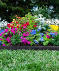 Super Easy Tall 2.5 Inch Woodgrain Wall No Dig Landscape Edging Kit In Black Holds Heavy Mulch in lush flower bed border