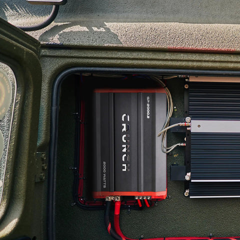 GP2000 2000W 2 Channel Car Amplifier installed in vehicle, showing stereo and bridged modes, 12 dB crossover, black color