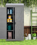Outdoor Cedar Wood Storage Shed With Metal Top Built To Last Tall Vertical Tool Cabinet For Backyard Garden Patio And Lawn Weather Resistant 68 By 33 By 20 Inches Large Capacity For Tools And Gear Grey shown in garden setting