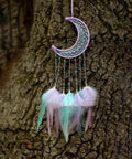 Crescent dream catcher with pastel feathers hanging on tree, using 8 Pcs Metal Moon Frame Hoops In Four Sizes For Dream Catchers