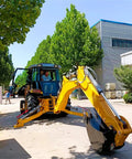 Towable Mini Digger For Demolition Tasks And Farm Projects, Compact Excavator on street with hydraulic system and attachments.