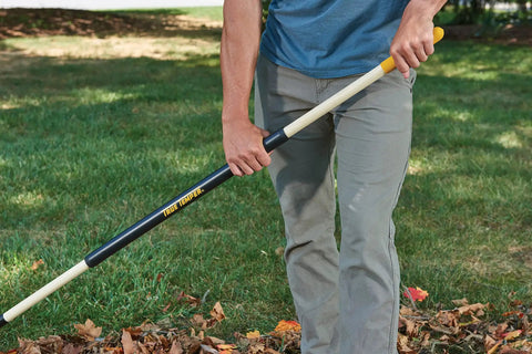 Person using Sturdy Steel Tine Leaf Rake With Hardwood And Steel Handle For Lawns And Dethatching 22 Tines 21.6 Inch Head Black