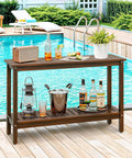 All Weather Patio Bar Table And Console With Two Shelves, 48 Inch Solid Wood Buffet by pool, with drinks and radio on top.