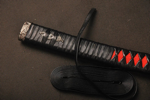 4.4 Yard Synthetic Leather Ito Tsukamaki Sageo Cord For Katana Wakizashi Tanto Scabbard Wrap DIY Handle Renewal Black High Quality Cord For Sword Maintenance displayed with wrapped katana hilt.