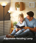 Tall Torchiere Floor Lamp With Adjustable Reading Light beside father and daughter reading on bed, cozy room setting
