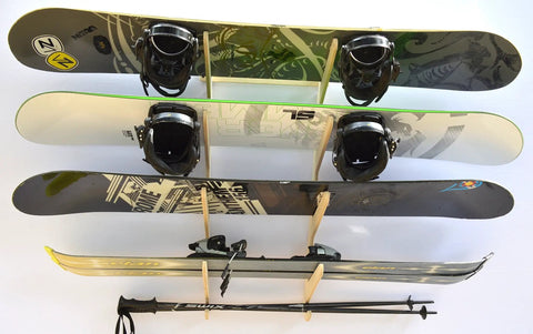 Premium Baltic Birch Wall Mount Snowboard Rack And Ski Holder For Four Boards displaying four snowboards with bindings.