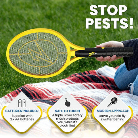 Person using High Voltage Bug Zapper Racket With 3500 Volt Grid Battery Powered Two Pack Includes Two AAs Instant Mosquito And Fly Elimination Portable Indoor Outdoor Bug Catcher Safe Easy Push Button Activation on a picnic.