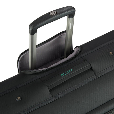 Close-up view of DELSEY rolling garment bag, black, with extended silver telescoping handle and grey interior lining