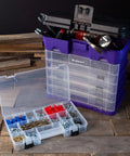 Durable 4 Drawer Tool Box With 19 Compartment Organizer for hardware shown in purple with transparent drawers on workshop floor.