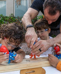 Kids wearing blue safety glasses with adult helping, suited for school and lab use, outdoor play, STEM projects