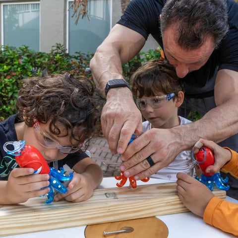 Kids wearing blue safety glasses with adult helping, suited for school and lab use, outdoor play, STEM projects