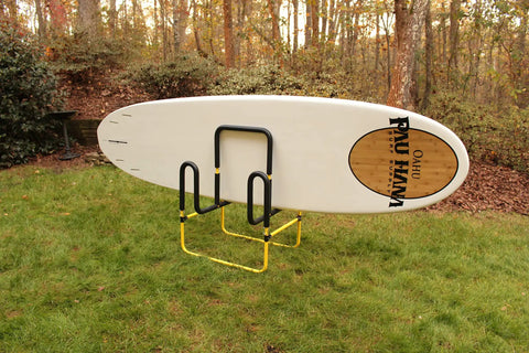 Double Up SUP Stand For Two Boards Holds Two Stand Up Paddle Boards or Surfboards With Durable Foam Padding Yellow in garden