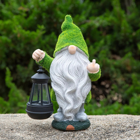 Angry Dude Gnome With Solar Lights, Large Funny Garden Statue For Outdoors, holding lantern against lush greenery